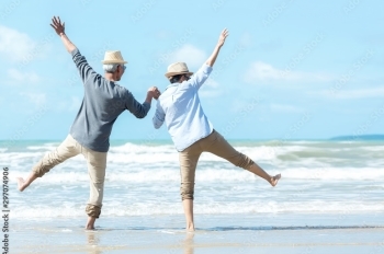 retired couple on the beach